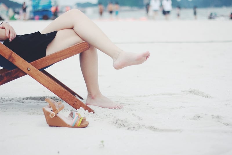 Woman meditating on the beach